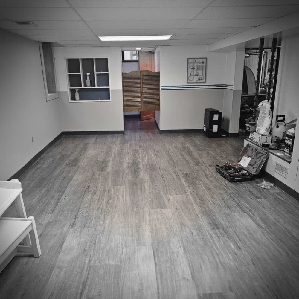 Picture of a recently repaired floor that has been affected by water damage and mold